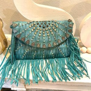 Turquoise western fringe cross body purse. Used like new condition!